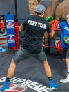 Members participating in boxing fitness training at Supreme Boxer Boxing Club in Lake Elsinore.