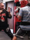 Members participating in boxing fitness training during gym classes in Lake Elsinore at Supreme Boxer Boxing Club