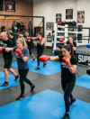 Members training together in group boxing classes at Supreme Boxer Boxing Club in Lake Elsinore
