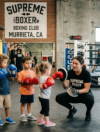 Toddlers learning beginner boxing drills at Supreme Boxer Boxing Club near Murrieta, CA