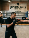 Boxing coach training athletes at Supreme Boxer Boxing Club near Perris, CA